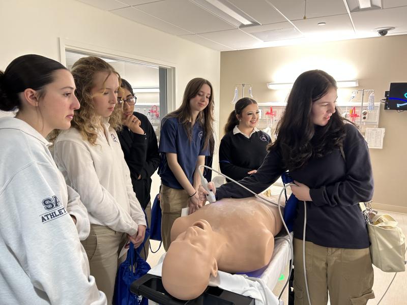 Sussex Academy student Kaylie Pederson, right, uses the sonogram while classmates (l-r) Emma Millman, Caroline Spicer, Simrah Ahmer, Caitlin Redick and Ava Huerta observe.